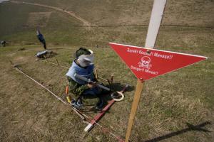 Deminer working with a metal detector in the practice minefield, Dushanbe, 20 March 2018. (OSCE/Nozim Kalandarov)