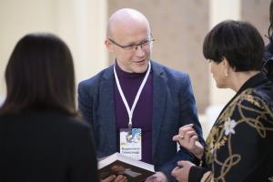 Oleksandr Vodyannikov speaks with Ukrainian journalist, lawyer and gender activist Larysa Denysenko at the Great Dialogue on the Idea of Constitutionalism and Women’s Rights in Kyiv, 20 December, 2021.  (OSCE)