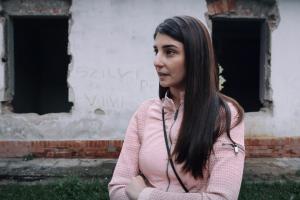Evelin Kecskés, an activist from the Hungarian NGO Roma Civil Rights Movement, speaks about evections in the “Numbered Streets” area of Miskolc, Hungary. (OSCE/Bogdan ILIESIU and Andrei CRISAN)