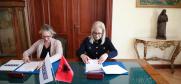 Acting Head of the OSCE Presence in Albania, Clarisse Pasztory (l) and Speaker of the Assembly of Albania Lindita Nikolla sign a Memorandum of Understanding to renew and strengthen partnership, Tirana, 20 March 2024.  (Assembly of Albania)