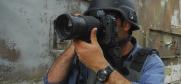 A press photojournalist in a conflict zone. (iStockphoto)