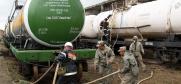 Personnel from Kazakhstan's military transfer mélange into the special cisterns that will be sent to Russia for safe disposal, Sary Ozek, 29 June 2013. (OSCE/Mikhail Assafov)