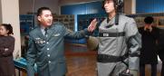 A military officer from Kazakhstan demonstrates the protective gear used by Kazakhstan’s sappers when dealing with explosive hazards during a field exercise at the Institute of Land Forces in  Almaty, 21 November 2013.  (OSCE/Mikhail Assafov)