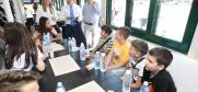 Ambassador Andrea Orizio, the Head of the OSCE Mission to Serbia, discusses  students’ impressions: for some of them it is the first visit to Belgrade, for many more the first time ever on a boat, Belgrade, 26 June 2019.
 (OSCE/Milan Obradović)