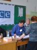 Voters names are checked against the voters list at an OSCE-run polling station in Zvečan/Zveçan, 20 May 2012.  (OSCE/Sarah Crozier)