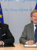 The Director of OSCE Office for Democratic Institutions and Human Rights (ODIHR) Michael Georg Link (l) and EU Commissioner for European Neighbourhood Policy and Enlargement Negotiations Johannes Hahn (r) sign an agreement launching a new project to support democratic elections in the Western Balkans in Brussels, 27 June 2017. (EC - Audiovisual Service/Georges Boulougouris)