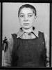 Photo of an unknown prisoner. One of a few remaining pictures from Gypsy camp in the Auschwitz-Birkenau State Museum Archives. (www.auschwitz.org)