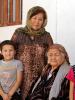 Mavlyuda Kasymova, leader of a Women's Initiative Group in Osh, with her family, 17 September 2014. (OSCE/Jonathan Perfect)