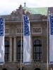 Flags with the English, German and Russian abbreviations for the Organization for Security and Co-operation in Europe in front of the Hofburg Congress Centre in Vienna, 10 May 2004. (OSCE/Mikhail Evstafiev)