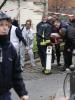 Firefighters carry a victim on a stretcher at the scene after a shooting at the Paris offices of Charlie Hebdo, a satirical newspaper, 7 January 2015 (REUTERS/Jacky Naegelen )