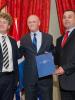 Uri Rosenthal, Foreign Minister of the Netherlands (c), presenting the Max van der Stoel Award to Sasho Stojkovski (r), Executive Director of the Nansen Dialogue Centre Skopje (NDC Skopje), and Veton Zekoli (l), Project Manager at NDC Skopje, at the Max van der Stoel ceremony, The Hague, 24 October 2011. (OSCE)