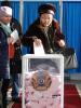A voter in Astana casts her ballot as others wait during Kazakhstan's early parliamentary elections. (OSCE/Thomas Rymer)