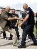 Participants of the OSCE Mission training on human rights compliance arrests and defensive techniques practice the proper use of Tonfa, a police tool used for arrests and self-defense, Vushtrri/Vučitrn, 18 August 2016. (OSCE/Besfort Oruci)