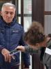 A polling station official examines a voter's hand for invisible ink in Podgorica during the presidential election in Montenegro, April 7 2013. The ink is applied to the index fingers of voters as a measure to ensure against multiple voting. (OSCE/Thomas Rymer)