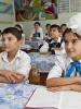 Schoolchildren during a class at a school piloting multilingual education, Jalal-Abad, 4 September 2014. (OSCE/Eric Gourlan)