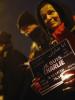 Following a shooting by gunmen at the offices of weekly satirical magazine Charlie Hebdo in Paris people brave heavy rain as they hold placards reading "I am Charlie", to pay tribute to victims during a vigil in Frankfurt, 8 January 2015.  (Reuters)