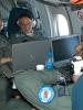 UK crew members monitor equipment on board a C Mk1 aircraft during a flight over Russia under the Open Skies Treaty, 24 May 2006. (OSCE)