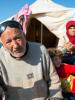 Muhammed Ramadan, 90, sitting with his family outside their tent at a refugee camp in Qatma (Atimah), Syria, 14 January 2013. The situation in Syria will be the subject of a special debate at the OSCE Parliamentary Assembly's Winter Meeting in Vienna on 22 February 2013. (iStockphoto)