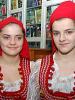 Two Kosovo Bosniak girls wear traditional clothing at an OSCE book donation ceremony, Prizren City Library, 13 February 2007. (OSCE/Hasan Sopa)