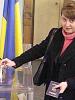 A voter casts her ballot at a polling station in Kyiv during the second round of the presidential election in Ukraine, 21 November 2004. (OSCE)