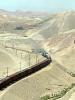 A train speeds across the dry land of southern Tajikistan. (OSCE/Astrid Evrensel)