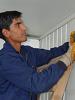 Enis Rusiti, a Roma youth who took part in vocational training organized by the OSCE Mission in Kosovo, works on the reconstruction of houses in Roma Mahalla, southern Mitrovica, which will enable the return of Roma, Ashkali and Egyptians, 13 June 2006. (OSCE/Hasan Sopa)