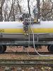 Ukrainian military personnel in protective equipment pumping melange, a toxic rocket fuel component, to special railway tanks during its removal from a storage depot in Kalynivka, Vinnytsya region, Ukraine, 14 November 2009. (OSCE/Anton Martynyuk)
