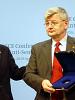 Chairman-in-Office Solomon Passy (left) presents German Foreign Minister Joschka Fischer the yellow star Passy's grandfather had worn in Bulgaria during World War II, Berlin, 29 April 2004. (OSCE/Keith Jinks)