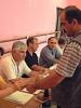 An election commission member marks a voter's thumb with ink during Albanian parliamentary elections, 24 June 2001. (Jens Eschenbaecher/OSCE)