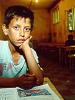 School boy in class at the Roma community camp in Krusevac, 
Kosovo, October 1999. (Lubomir Kotek/OSCE)