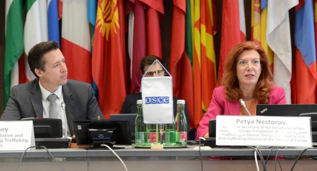 Valiant Richey, OSCE Special Representative and Co-ordinator for Combating Trafficking in Human Beings, and Petya Nestorova, Executive Secretary of the Secretariat of the Council of Europe Convention on Action Against Trafficking in Human Beings and Head of the Anti-trafficking Division of the Council of Europe at the Meeting of National Anti-Trafficking Co-ordinators and Rapporteurs or equivalent mechanisms, Vienna, 13-14 June 2022.
 (OSCE/Micky Kroell)