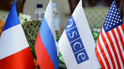 Table flags of the Russian Federation, France, the OSCE and the United States of America